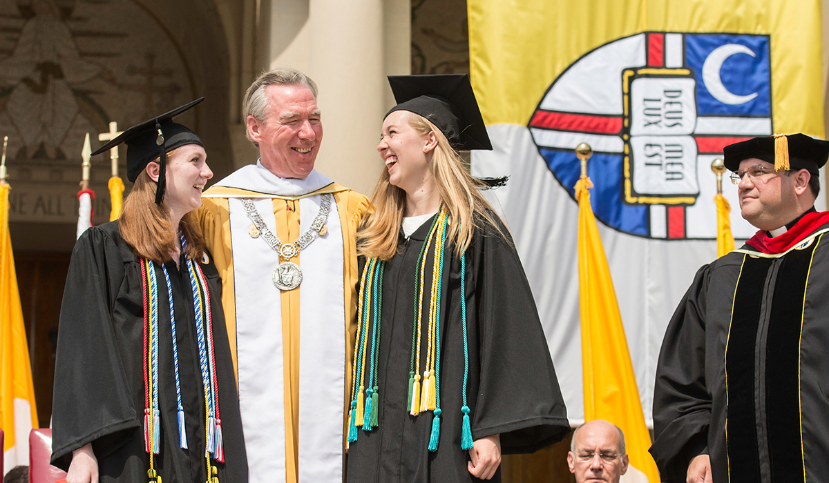 Alumni and President Garvey