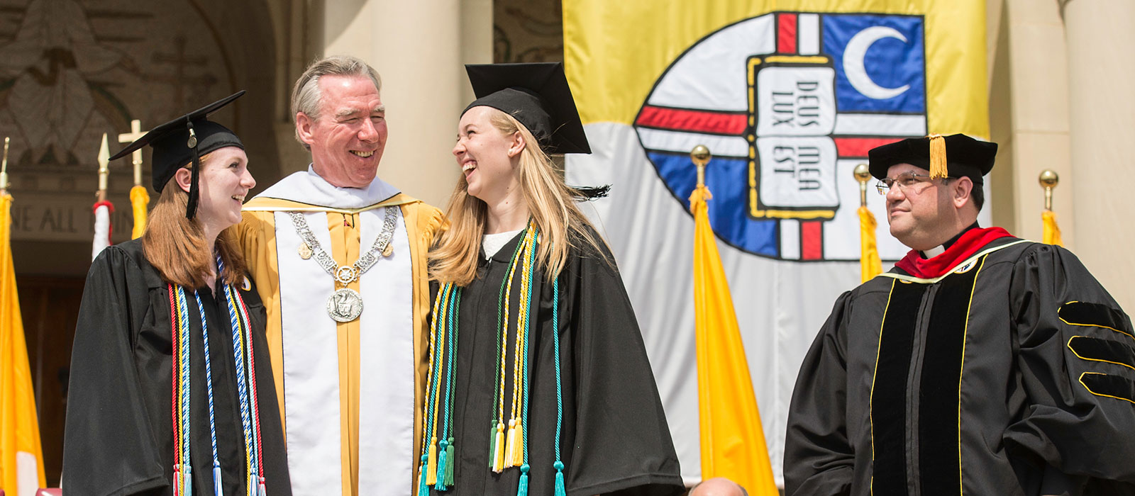 Alumni and President Garvey